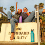 40oz Onyx/Splash Bottles with Spout Lids. Woman carrying splash bottle on a lifeguard tower with a friend.
